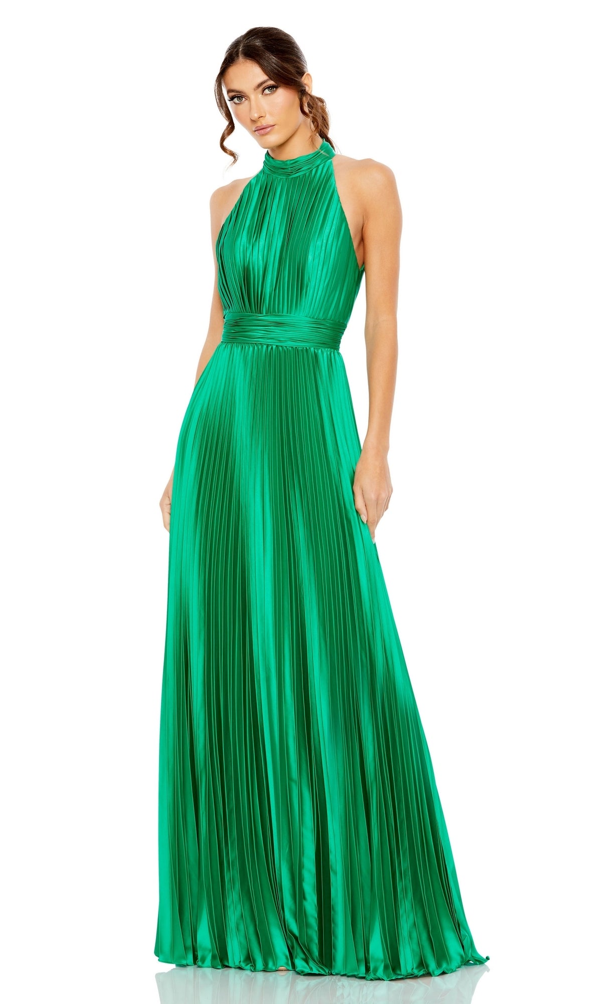 A woman wears the floor-length Mac Duggal 26992, a sleeveless emerald green long pleated A-line formal dress with a sophisticated high neckline.
